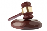 Vector of an auctioneer's wooden gavel hitting a wooden sound block