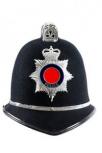 Photograph of a police helmet with a constabulary badge on the front