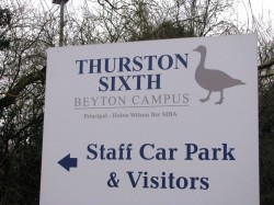 Photograph of Thurston Sixth road sign with logo and direction for visitors