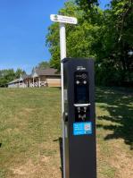 EV charging point with the sports pavilion in the distance