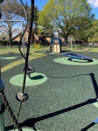 A play park, showing climbing frames and swings